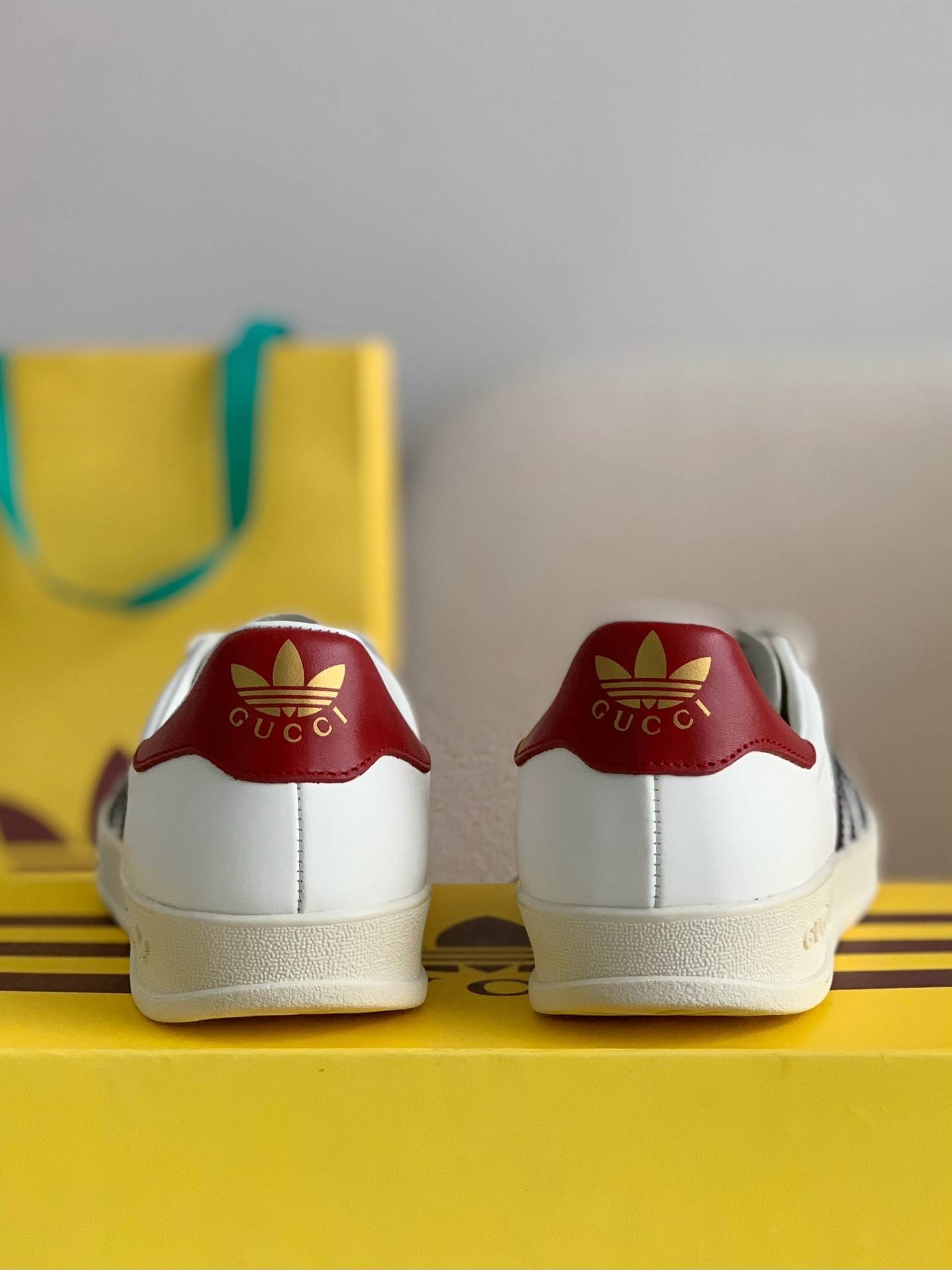 GU*I× Adidas sneakers