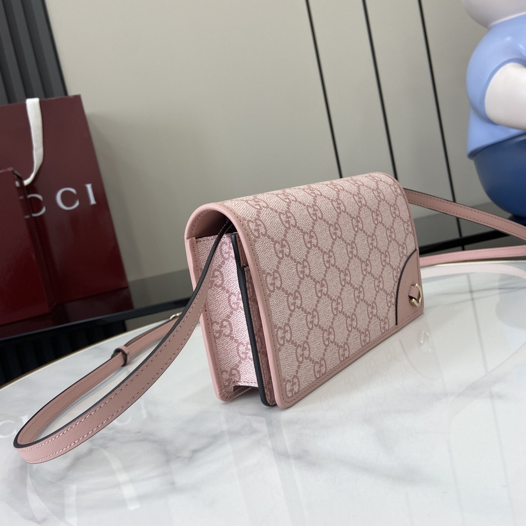 G*u*i emblem handbag